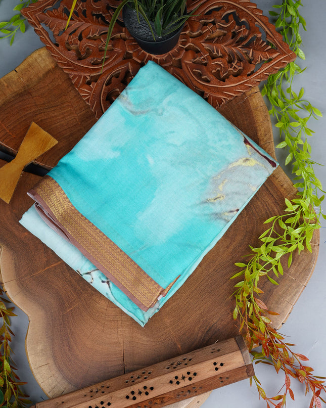 Muslin Silk Saree With Abstract Print Complimentedly A Golden Zari Border - Blue