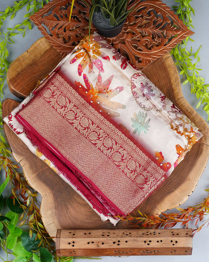 Banarasi Saree featuring Half white body with colorful Sequin like floral designs & a broad intricately woven red & Gold Zari border - Half White