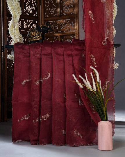 Linen saree with thread work motifs and scallop border - Maroon