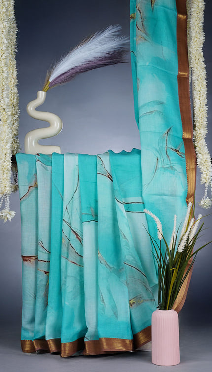 Muslin Silk Saree With Abstract Print Complimentedly A Golden Zari Border - Blue