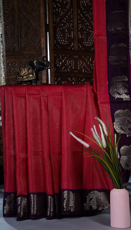 Green silk saree with all over golden zari  check weaving and contrast elephant border - Red