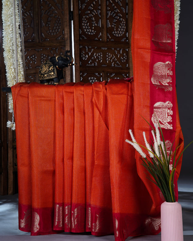 Green silk saree with all over golden zari  check weaving and contrast elephant border - Orange