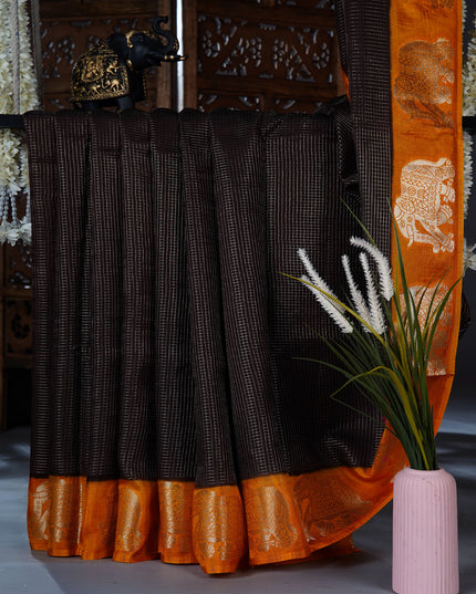 Green silk saree with all over golden zari  check weaving and contrast elephant border - Brown