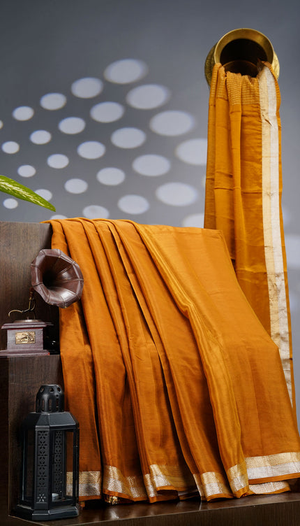 Binny Crepe Silk Saree With Golden Silver Zari Border - MUSTERED