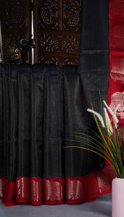 Green silk saree with all over golden zari  check weaving and contrast elephant border - Black