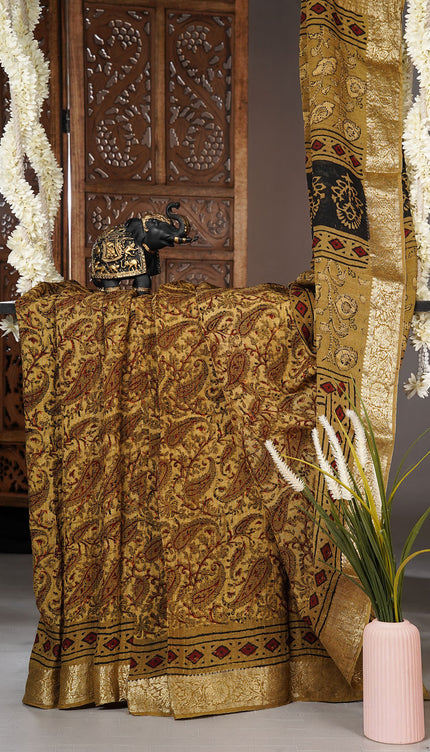 Chiffon sarees with Kalamkari print and zari-woven borders - Mustered Yellow