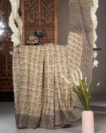 Chiffon sarees with Kalamkari print and zari-woven borders - Cream