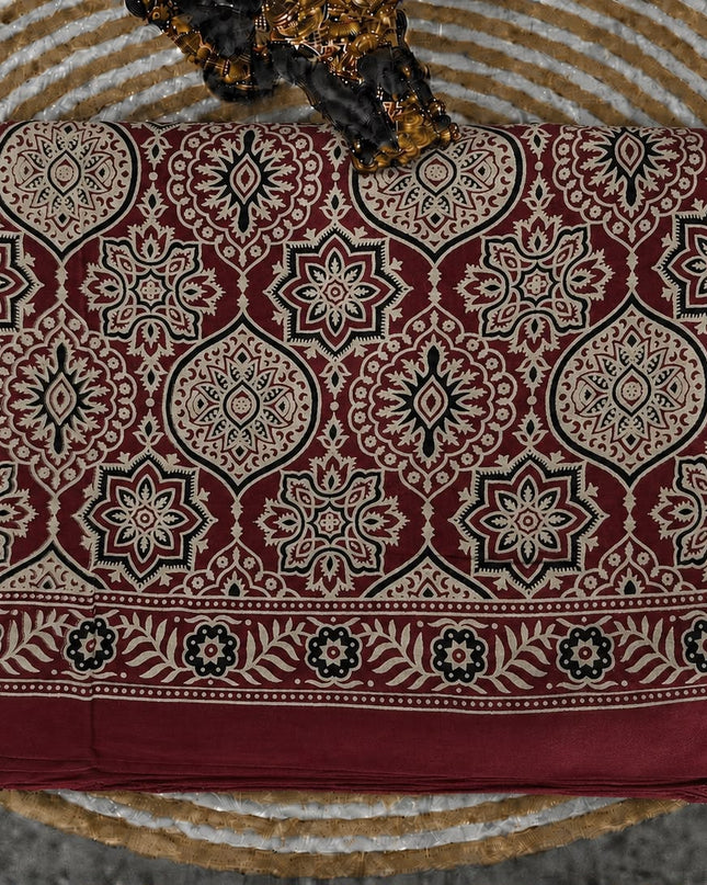 Modal silk saree with ajrakh Design and  Contrast Border -  Maroon