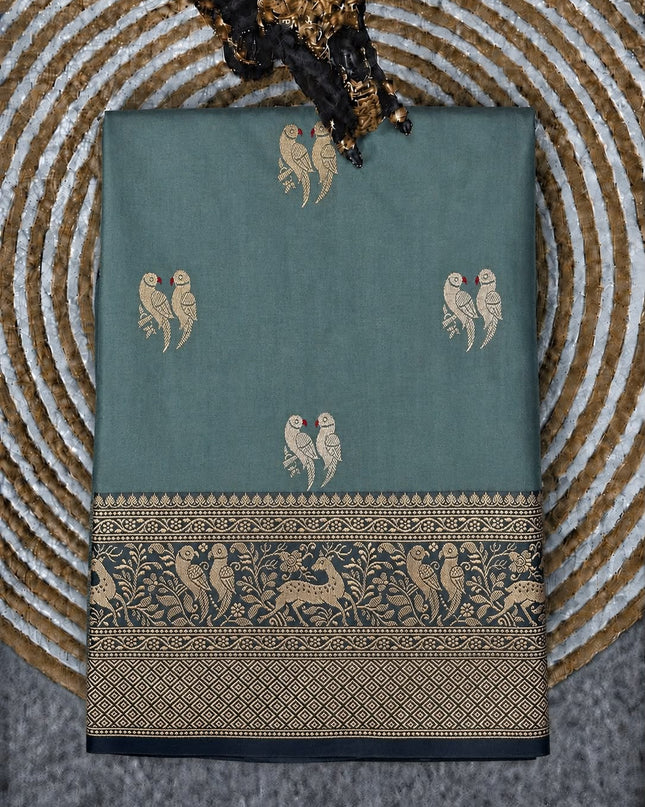 Kathan Silk Saree With All over Gold & Silver Zari Dual Parrot  Buttes and Golden Zari Weaving Cow Border - Light Blue