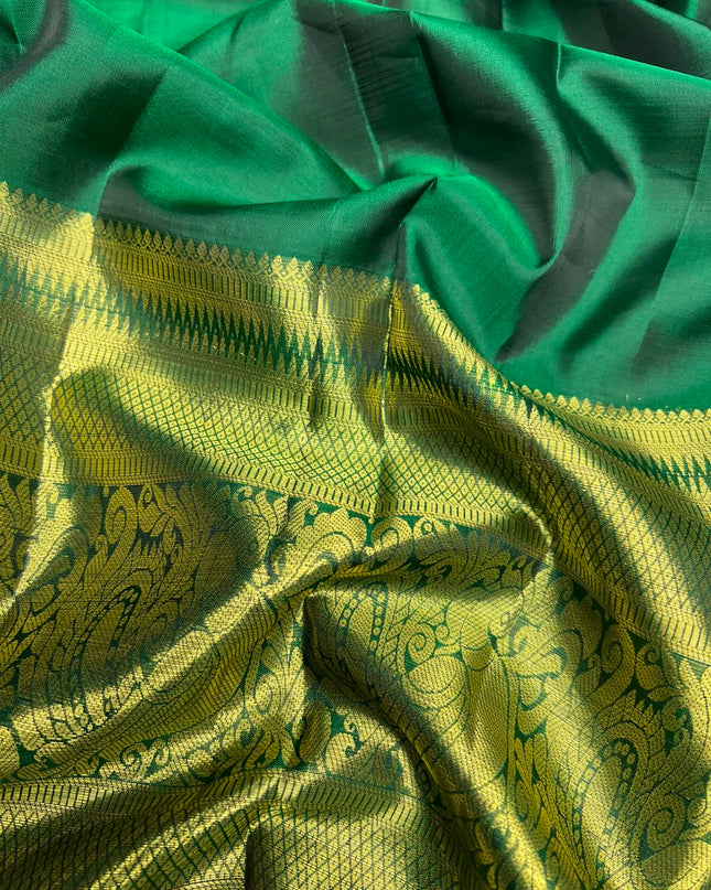 Pure Kanchi Pattu Saree With Allover Stripes Design and Rudraksh Peacock Motifs and Golden Border - Green