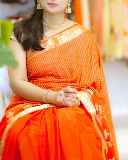 Koren Crepe Saree With All Over Checks Design and Flower Design Border - Orange