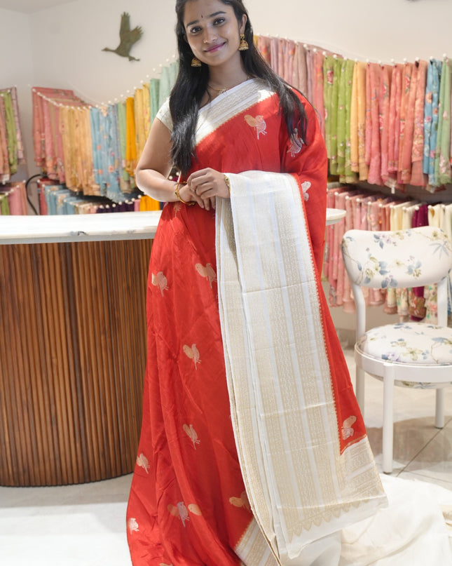 Raw silk sarees with Gold and Silver Zari Peacock design and Contrast border -Red