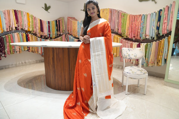 Raw silk sarees with Gold and Silver Zari Peacock design and Contrast border - orange