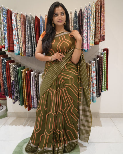 Dola silk sarees with Geometrical Design and Zari Stripes Border- Mehandi green