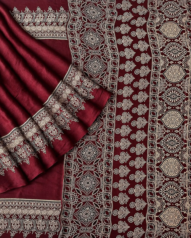 Modal silk saree with ajrakh Design and  Contrast Border -  Maroon