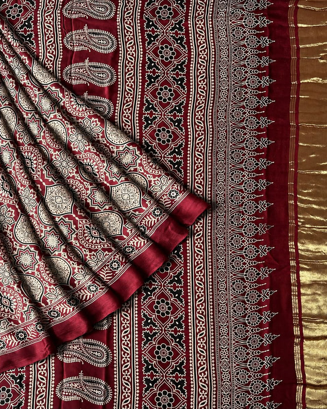 Modal silk saree with ajrakh Design and  Contrast Border -  Maroon