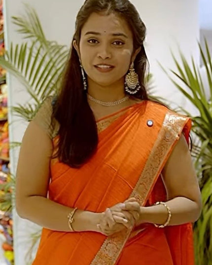 Koren Crepe Saree With All Over Checks Design and Flower Design Border - Orange